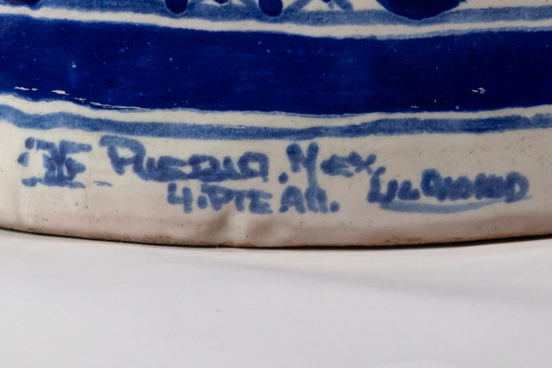 Ysauro Uriarte's monogram and text reads, "Puebla, Mex. 4 Pte. 914"