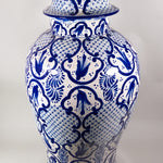 A classic cobalt blue and white talavera jar with regal artwork.