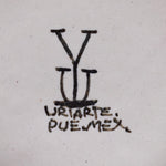 Ysauro Uriarte's monogram and text reads, "Uriarte. Pue. Mex."