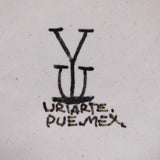 Ysauro Uriarte's monogram and text reads, "Uriarte. Pue. Mex."