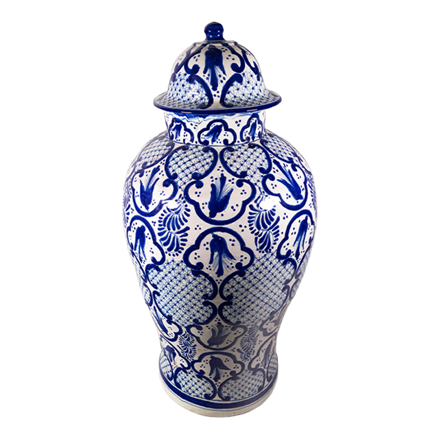 A classic cobalt blue and white talavera jar with regal artwork.