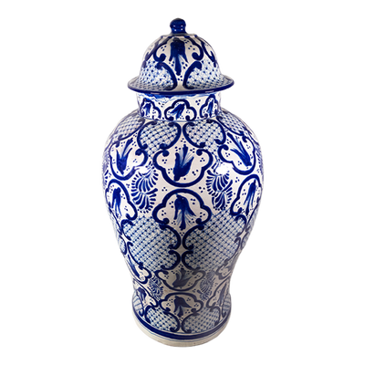 A classic cobalt blue and white talavera jar with regal artwork.