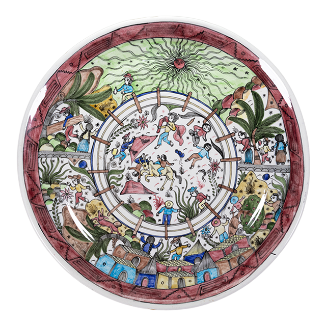 A round ceramic plate with artwork of bull fight scene in the center and spectators all around.