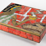 Brass box with orange glass mosaic pieces depicting an Aztec woman holding a bowl of steaming food as an offering.