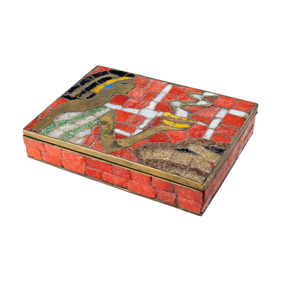 Brass box with orange glass mosaic pieces depicting an Aztec woman holding a bowl of steaming food as an offering.