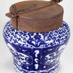A classic cobalt blue and white talavera piece with an iron lid.