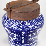 A classic cobalt blue and white talavera piece with an iron lid.