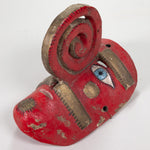 A red polychromed painted Nahua mask with a spiral nose and gold leaf painted details.