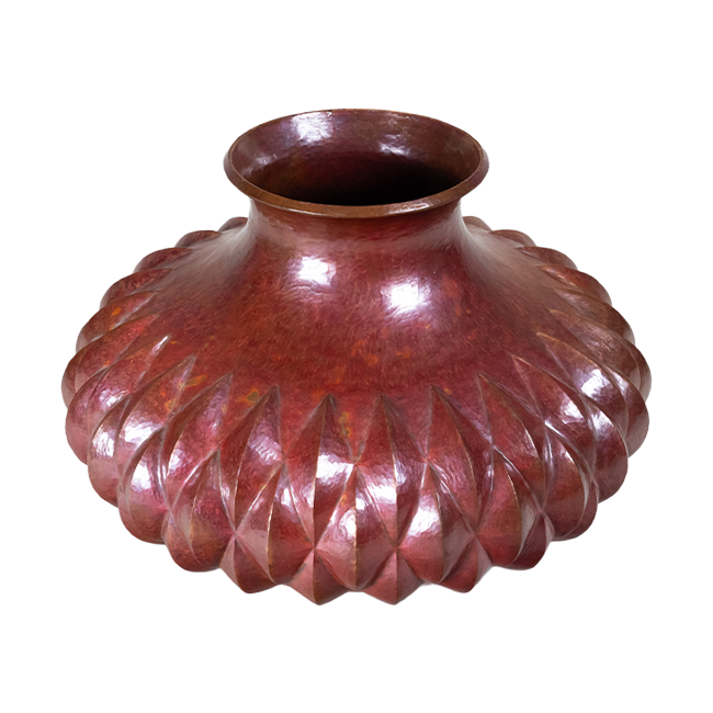 Copper vase with a diamond pattern and inverted top rim.