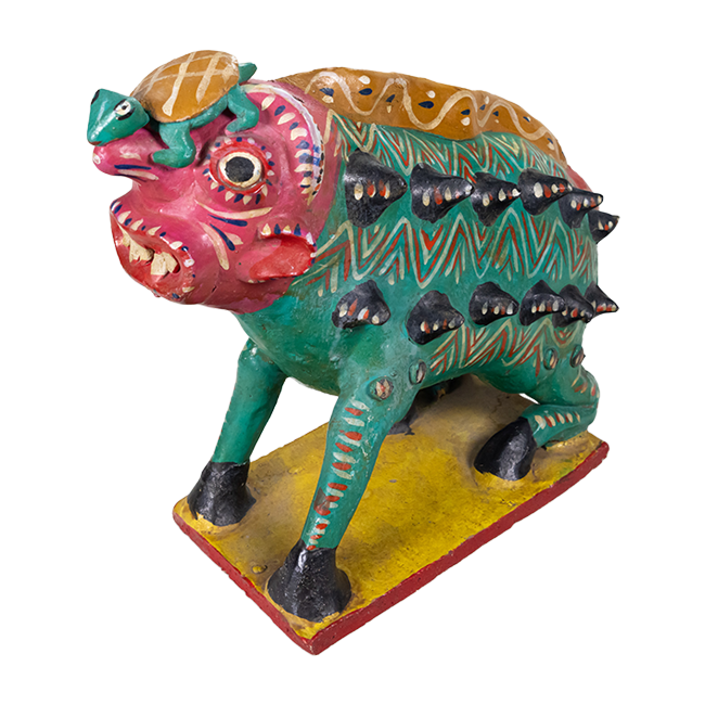 Nagual pottery figure with a human-like face, sharp teeth, and a green animal body with spikes coming out on the side, hooves, and a turtle on its head.