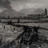 Black and white photograph of the Eruption of Parícutin with the Church of San Juan Parangaricutiro in the background.
