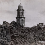 Black and white postcard of the Church of San Juan Parangaricutiro surrounded by the ash from the aftermath of  the eruption of Parícutin.