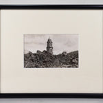 Framed black and white postcard of the Church of San Juan Parangaricutiro surrounded by the ash from the aftermath of  the eruption of Parícutin.
