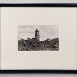 Framed black and white postcard of the Church of San Juan Parangaricutiro surrounded by the ash from the aftermath of  the eruption of Parícutin.