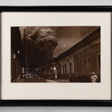Framed sepia photograph of the eruption of Parícutin, taken in the streets of Uruapan.