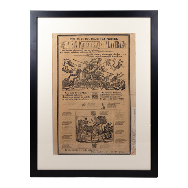 Framed and matted broadside print on beige paper entitled, "Esta Es De Don Quijote La Primera, La Sin Par La Gigante Calavera," with artwork of a calavera riding on a skeletal horse and wielding a spear, crashing through other calaveras. Another calavera riding a skeletal horse image is shown beneath.